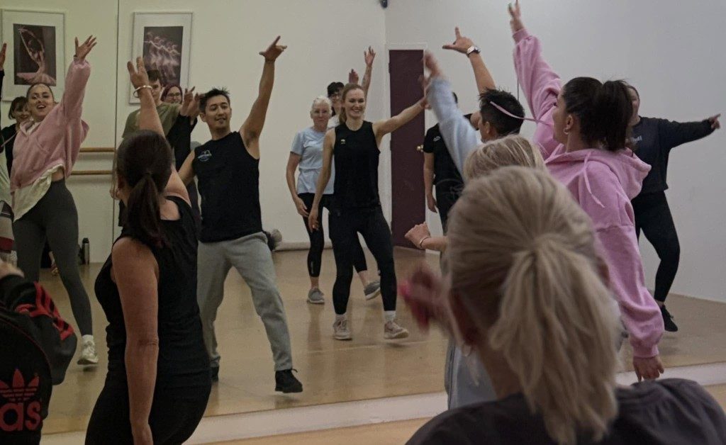 A Kinetics 360 class moving together in the studio